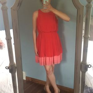Red pleated flowy cocktail dress
